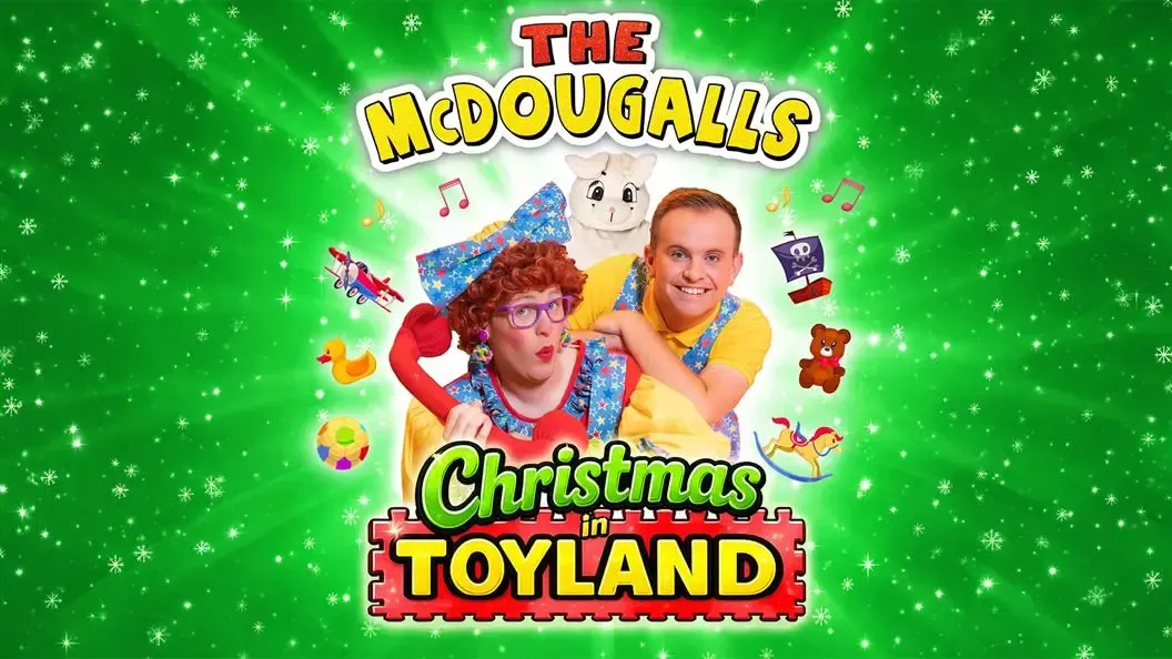 Two people and a person in a bunny rabbit suit with a selection of toys around them and the wording The McDougalls Christmas in Toyland